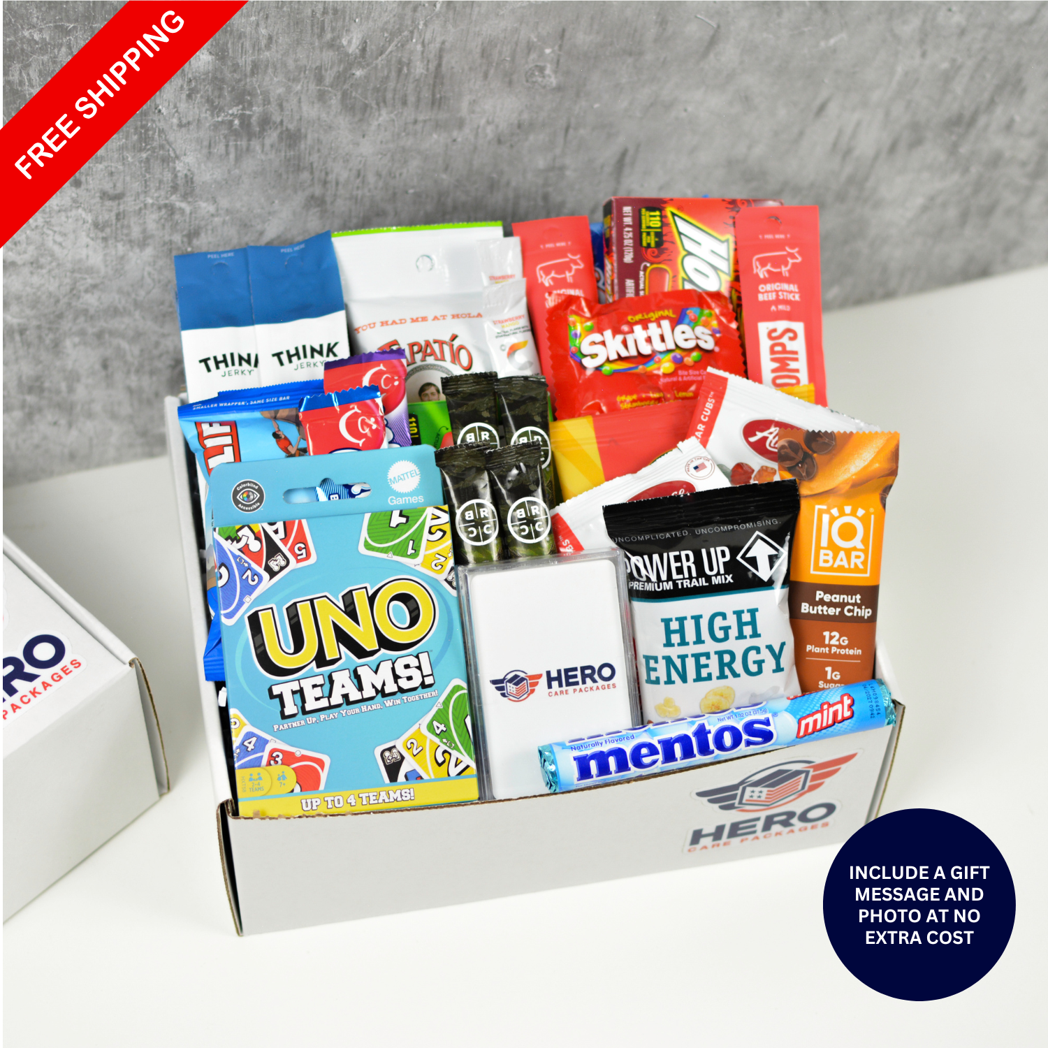Signature Hero Care Package with protein snacks, trail mix, card games, and candy for deployed military troops