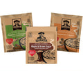 Three packages of Quaker instant oatmeal with different flavors on a white background