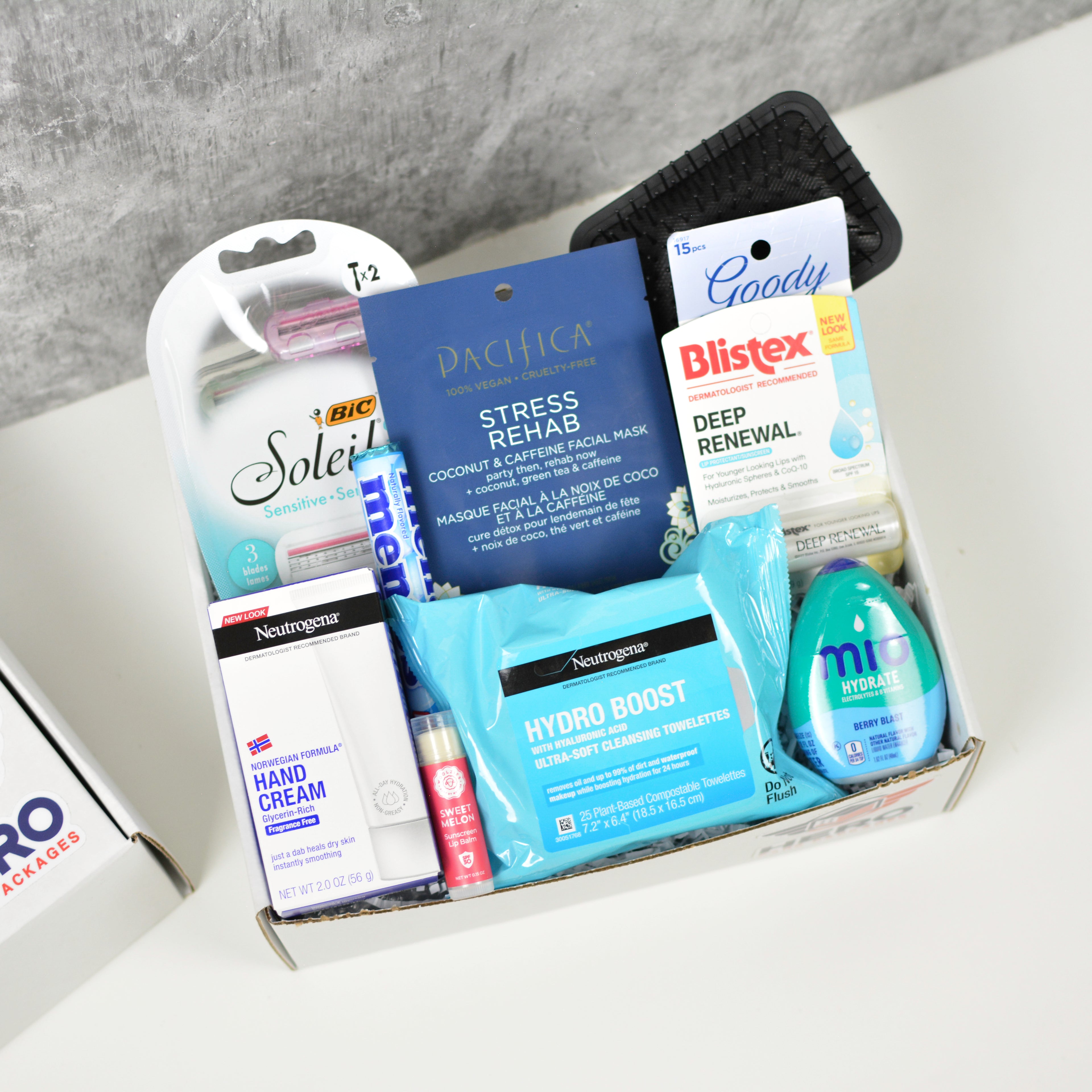 Her Call of Duty military care package with women’s self-care items neatly arranged in a gift box for deployed service members