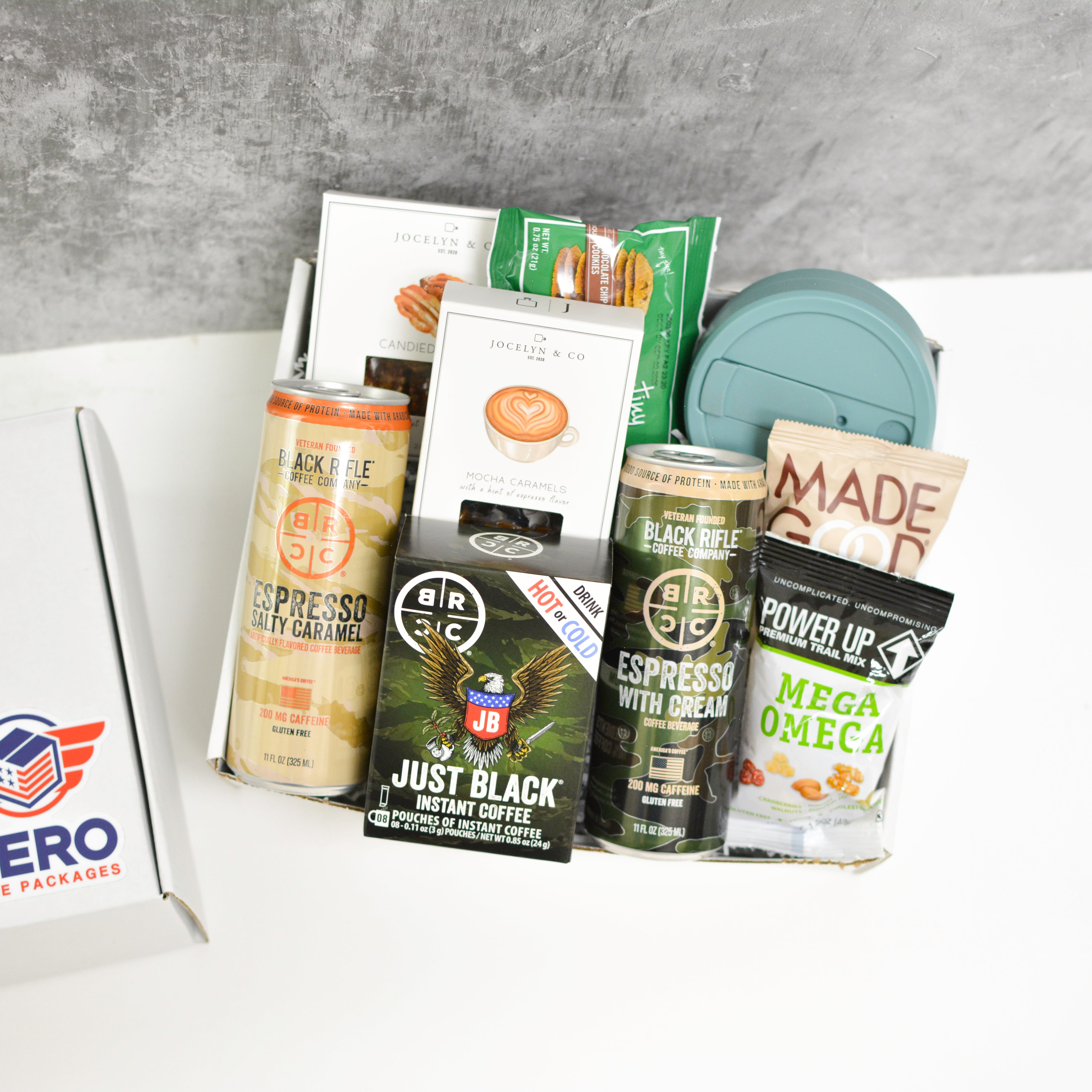 Rise and Grind Military Care Package with coffee drinks, energy snacks, and sweet treats arranged in a gift box for deployed service members