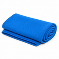 Blue cooling towel folded and rolled on white background